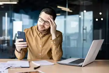 A man holding his phone